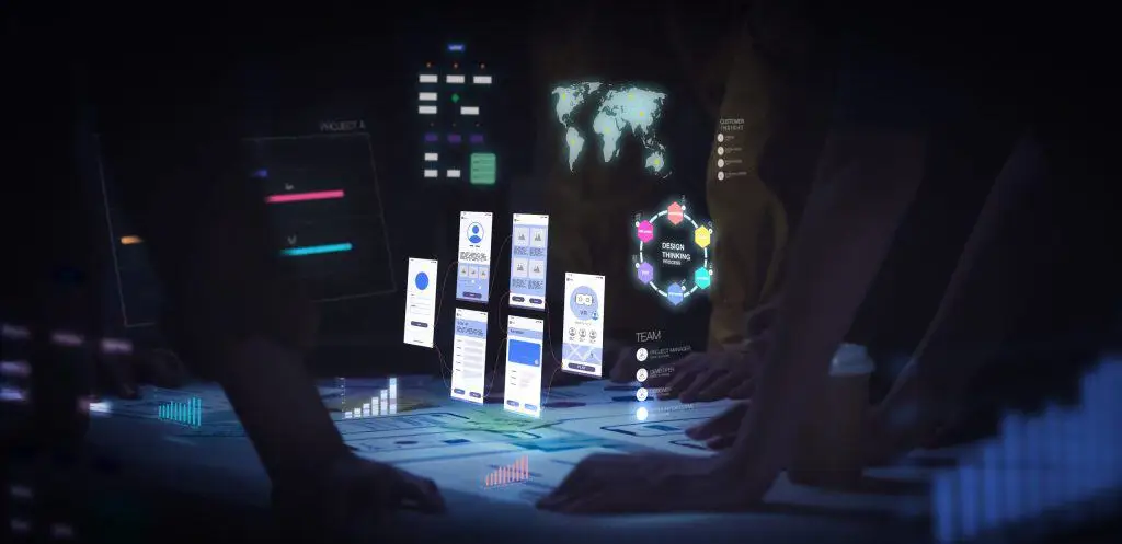 Diseñadores UX/UI trabajando con wireframes de interfaces móviles